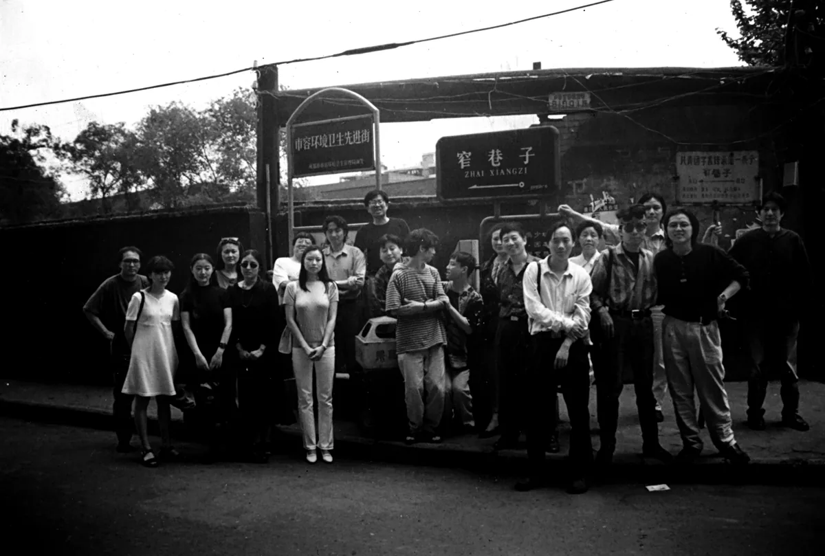 1996, Zhai Alley, Chengdu. From right: Zhou Chunya, Dongfang Tenghong, Yan Yongming, Gao Xiaohua, the artist's mother, Zhang Jun, Jiang Yixun, Liu Xuelian, Shen Xiaotong, Luo Fahui, Mou Heng, Yuan Zhengyang, He Duoling, Geli, Ai Xuan, Zhai Yongming, Tang Lei, Li Li, Zhang Qian, Zhang Xiaogang